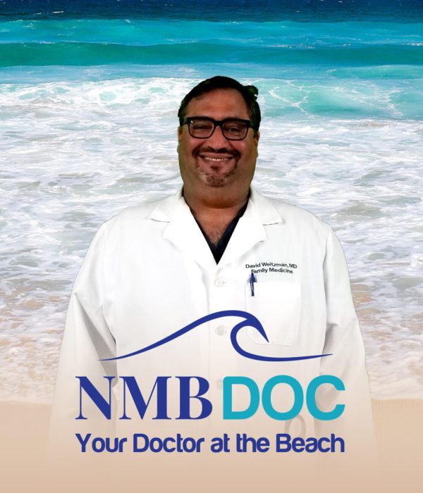 Dr David Weitzman in front of beach ready for providing concierge care